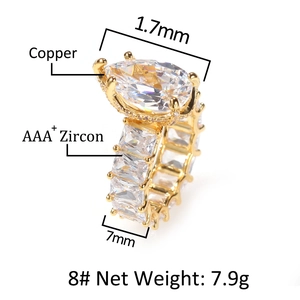 Detail view of pear-cut AAA zircon ring in gold finish with copper base specs