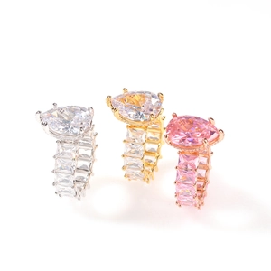 Detailed close-up of pear-shaped cubic zirconia hip-hop rings with full eternity band details