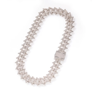 Macro shot of a 20mm silver-tone thorn Cuban link necklace with zircon pave setting