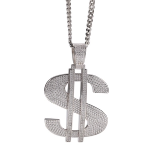 Macro view of silver dollar sign pendant with iced out cubic zirconia stones