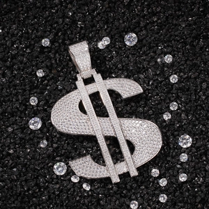 Detailed macro view of large silver dollar sign pendant with iced out pave zircon stones