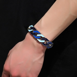 Detail of men's geometric link bracelet with gradient blue enamel on a wrist
