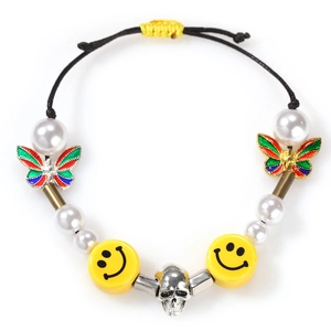 Hiphop bracelet with pearls, colorful butterflies, smiley beads and a silver skull charm