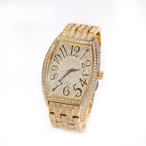 Detail of tonneau-shaped gold watch with full crystal inlay and artistic numerals
