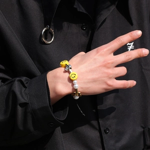 Hiphop beaded bracelet with yellow smile faces, white pearls, and skull butterfly pendants