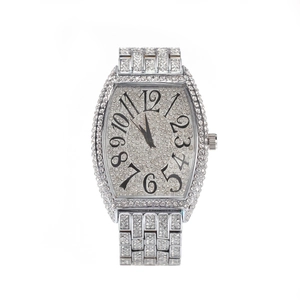 Detailed view of luxury tonneau-shaped watch with full white rhinestones and Arabic numerals