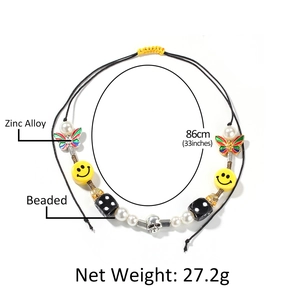 Hiphop beaded necklace with smiley face, pearls, butterfly, and skull charms, 86cm length