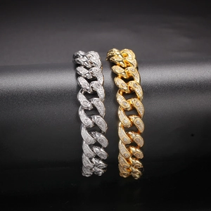 Detail of 15mm Cuban link chains in gold and silver finish with pavé set micro zircons