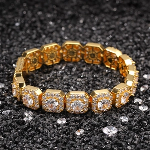 Macro detail of gold 12.5mm hip hop link bracelet with micro-paved cubic zirconia