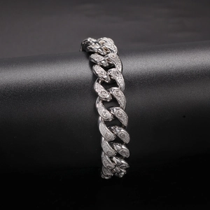 Detailed macro of 15mm cuban chain with micro-paved cubic zirconia and leaf patterns