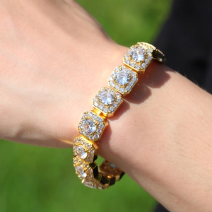 Detail of 12.5mm gold hip hop bracelet with iced out square links and round center stones