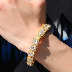 Detail of 12.5mm gold hip hop bracelet with micro paved cubic zirconia on male wrist