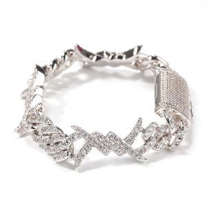 Detail view of silver Cuban link bracelet with zirconia inlay and X-shaped decorative elements