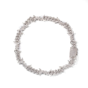 Macro shot of silver hip hop barbed wire cuban chain necklace with micro pave cubic zirconia