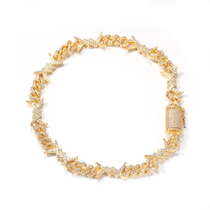 Macro shot of gold-plated thorn link necklace with cubic zirconia paving and square clasp