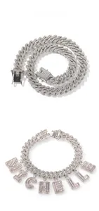 Detail of silver Cuban link jewelry set with sparkling MICHELLE iced out letter charms