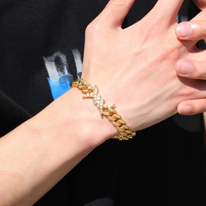 Hip hop gold plated Cuban link bracelet with sparkling zircon and X-cross design detail