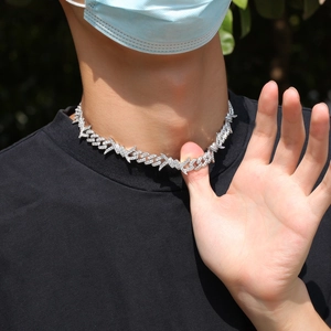 Detailed view of silver barbed wire chain necklace with sparkling zircon stone pavé