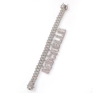 Detailed macro view of silver Cuban chain with diamond-encrusted MICHELLE name pendant