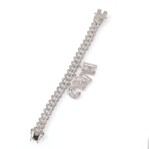 Detail of silver Cuban link necklace featuring iced out CMHI crystal letters