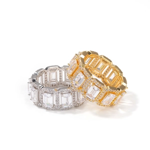 Detail of hip-hop rings featuring emerald-cut cubic zirconia in gold and silver finish