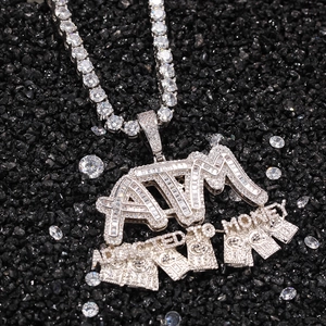 Macro shot of silver ATM Money hip-hop pendant with cubic zirconia on a tennis chain