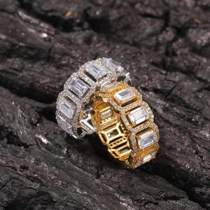 Detail of gold and silver rectangle zircon rings with high-shine crystal pavé setting