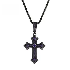 Macro view of Gothic black cross pendant with purple zircon stones and twist chain