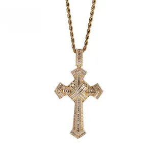 Detail shot of a gold-plated cross pendant encrusted with diamonds on a twisted rope chain