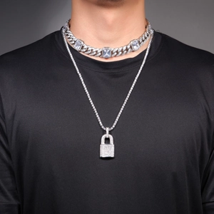 Detail of hip hop silver necklace set with zircon padlock pendant and cuban chain link