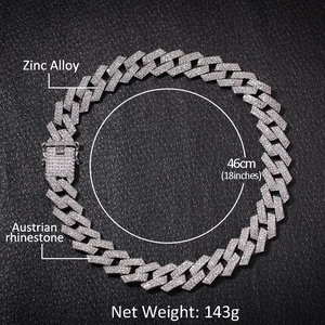 Mens silver Cuban link necklace with 3-row Austrian rhinestones on black leather background