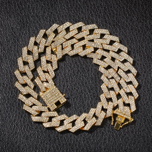 Iced out gold Cuban link necklace with three rows of diamonds and a square buckle