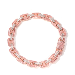 Macro detail of 15mm rose gold iced out Cuban link chain with pink and white zircon stones