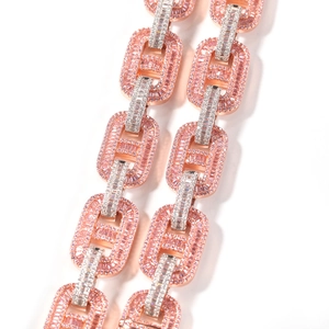 Macro view of 15mm rose gold Cuban chain links with pink baguette and white round zircons