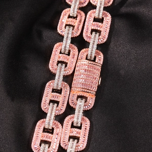 Macro shot of 15mm hip hop cuban link necklace with pink and silver baguette zircon