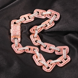 Luxurious 15mm iced out Cuban link chain with baguette-cut zircons in two-tone design