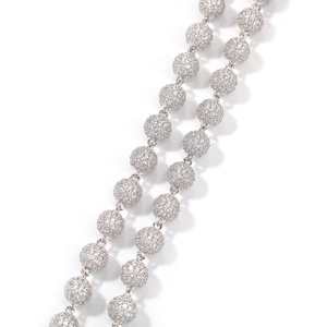 Macro shot of hip hop ball chain necklace with white gold plating and pavé set zircons
