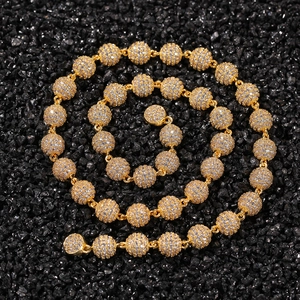 Close-up of golden hip hop bead necklace featuring micro-pave white zircon crystals