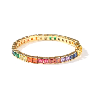 Detailed close-up of a rainbow tennis bracelet with colorful square zircon stones on gold