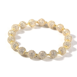 Detailed macro shot of hip hop gold beaded bracelet with micro-paved zircon crystals