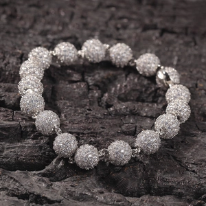 Macro shot of hip hop round ball bracelet with micro-paved cubic zirconia stones