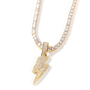 Macro detail of lightning bolt pendant necklace with tennis chain and paved zircons