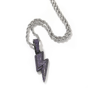 Macro detail of lightning bolt pendant with purple zircon stones and silver rope chain