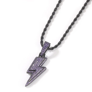Macro shot of purple cubic zirconia paved lightning pendant on gunmetal rope chain