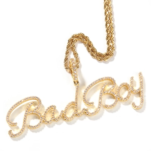 Detailaufnahme der goldenen Bad Boy Halskette mit Zirkonia-Steinen und gedrehter Seilkette