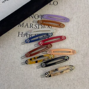 Lot de 10 barrettes ovales en acétate français ornées de strass multicolores