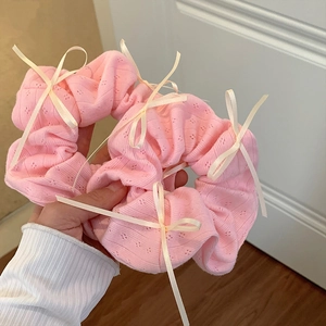 Pink pointelle knit scrunchies with white satin bows for women's hair accessories