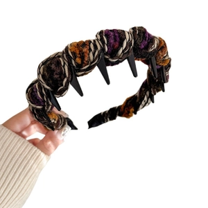 Chunky knit headband with multi-color purple and orange yarn and non-slip inner teeth