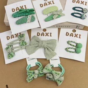 Green floral fabric bow hair clip and elastic tie set for girls with knit textures