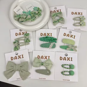 Floral green fabric bow hair clips and ties set for girls with handmade embroidery details